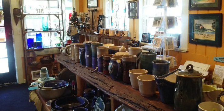 Inside All That Matters gallery — pottery and handcrafted goods on display